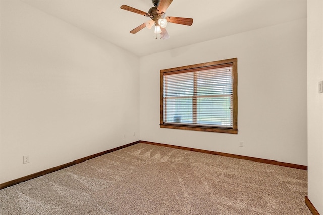 5300 Highland Dr, Denison, TX 75020 - spare room featuring carpet, baseboards, and a ceiling fan