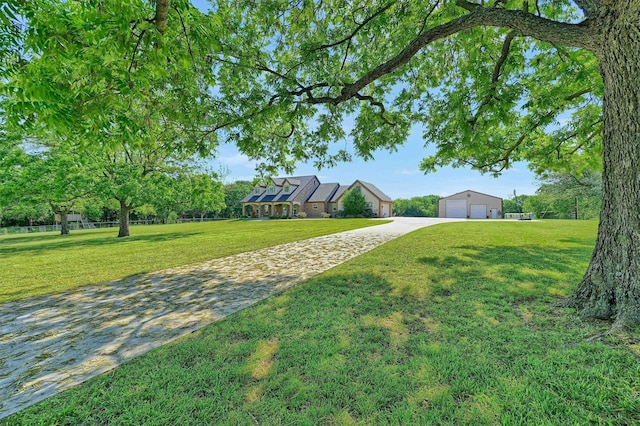 5300 Highland Dr, Denison, TX 75020 - view of grassy yard featuring a garage