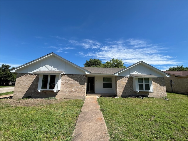1153 Tracy Ln, Lancaster, TX 75134 - view of front facade featuring brick siding and a front lawn