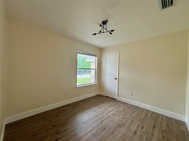1153 Tracy Ln, Lancaster, TX 75134 - spare room featuring wood finished floors and baseboards