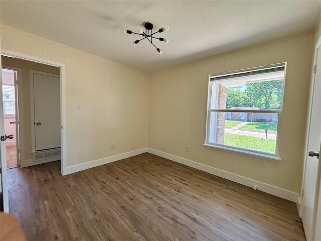1153 Tracy Ln, Lancaster, TX 75134 - unfurnished room featuring wood finished floors and baseboards