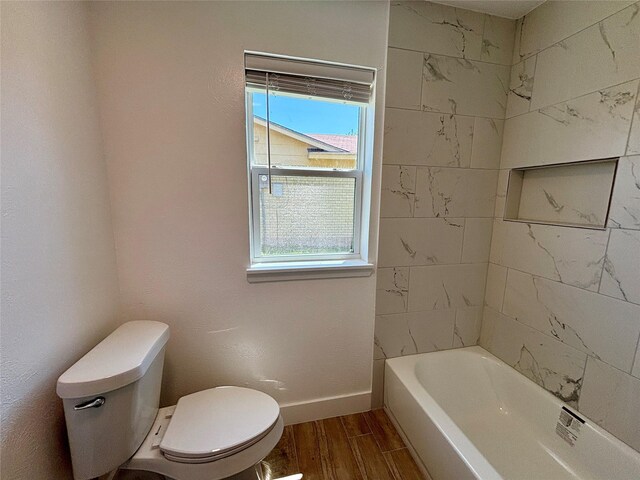1153 Tracy Ln, Lancaster, TX 75134 - full bathroom featuring toilet, plenty of natural light, wood finished floors, and baseboards