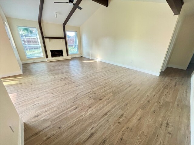 1153 Tracy Ln, Lancaster, TX 75134 - unfurnished living room with baseboards, a ceiling fan, and wood finished floors