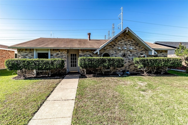 2606 Cedar Elm Ln, Garland, TX 75043 - view of front of property with a front lawn, a shingled roof, and brick siding
