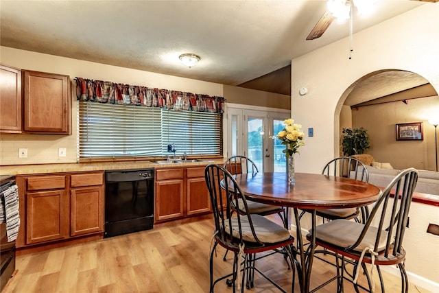 2606 Cedar Elm Ln, Garland, TX 75043 - kitchen featuring dishwasher, light wood-style floors, arched walkways, brown cabinetry, and a ceiling fan