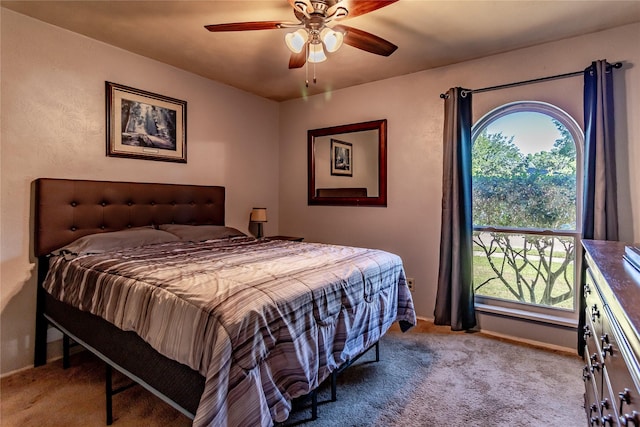 2606 Cedar Elm Ln, Garland, TX 75043 - carpeted bedroom with baseboards and a ceiling fan
