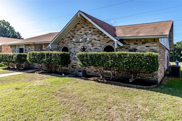 2606 Cedar Elm Ln, Garland, TX 75043 - tudor house with central AC unit, a front yard, and roof with shingles