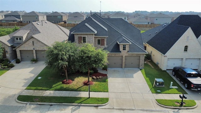 1103 Bantham Way, Forney, TX 75126 - view of front of house with concrete driveway, brick siding, and a garage