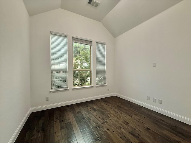 1103 Bantham Way, Forney, TX 75126 - empty room featuring dark wood-style flooring, vaulted ceiling, and baseboards