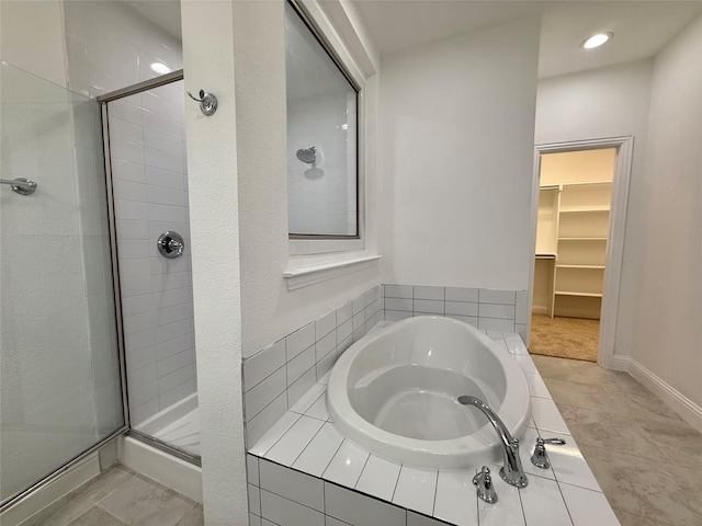1103 Bantham Way, Forney, TX 75126 - bathroom with a stall shower, a bath, a spacious closet, and recessed lighting