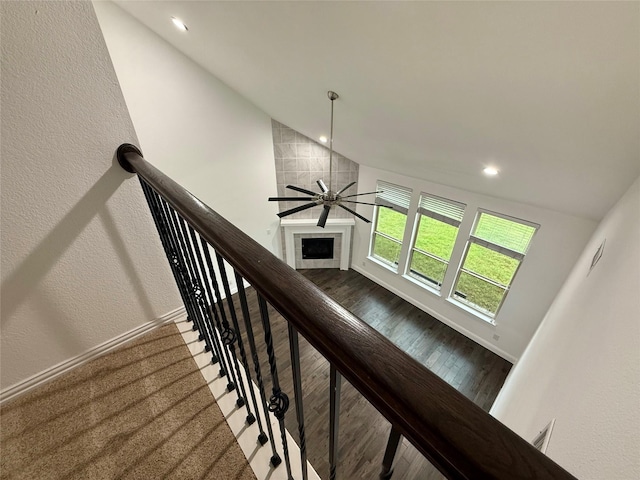 1103 Bantham Way, Forney, TX 75126 - stairs with lofted ceiling, ceiling fan, recessed lighting, wood finished floors, and a tile fireplace