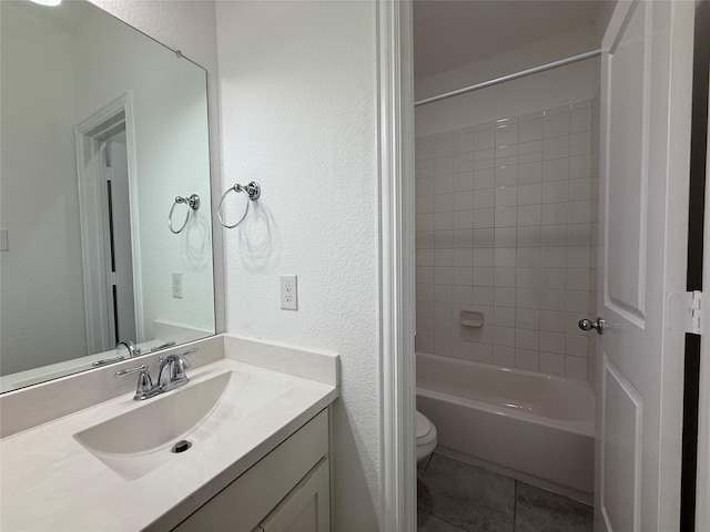 1103 Bantham Way, Forney, TX 75126 - bathroom with toilet, tile patterned flooring, vanity, a textured wall, and  shower combination