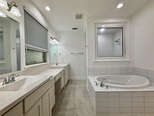 1103 Bantham Way, Forney, TX 75126 - bathroom with a bath, double vanity, recessed lighting, tile patterned flooring, and tiled shower