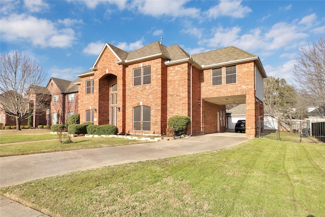 traditional-style home with a carport, brick siding, driveway, roof with shingles, and a gate