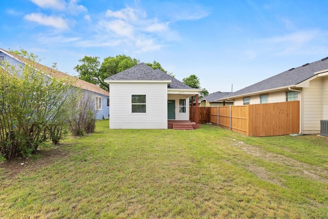 607 W Sears St, Denison, TX 75020 - back of property featuring a shingled roof and central AC