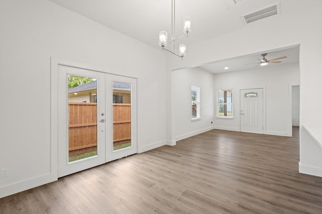 607 W Sears St, Denison, TX 75020 - spare room with wood finished floors, baseboards, and french doors