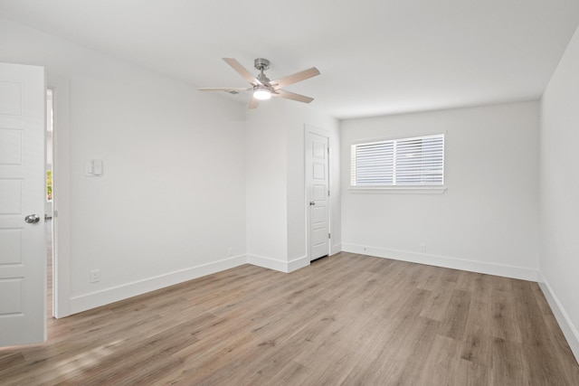 607 W Sears St, Denison, TX 75020 - unfurnished room featuring light wood-style flooring, baseboards, and a ceiling fan