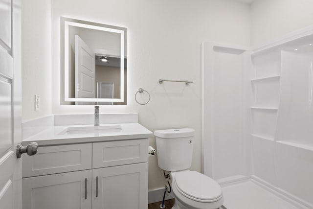 607 W Sears St, Denison, TX 75020 - bathroom with vanity, toilet, and a shower