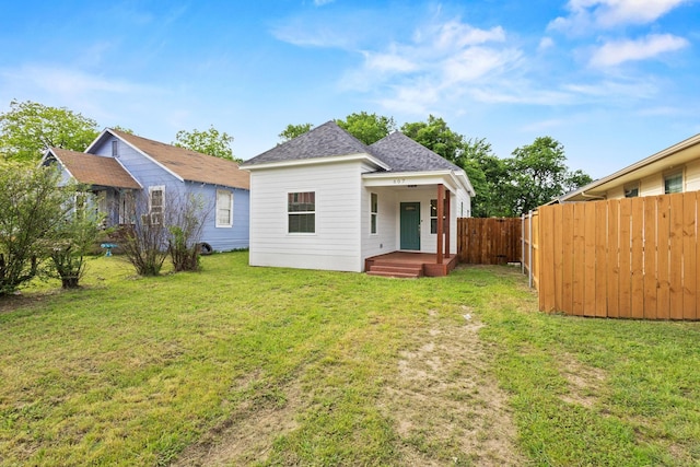 607 W Sears St, Denison, TX 75020 - rear view of property featuring a shingled roof