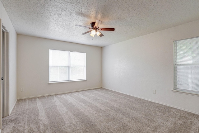 914 Gillon Dr, Arlington, TX 76001 - unfurnished room with a ceiling fan, carpet floors, a textured ceiling, and baseboards