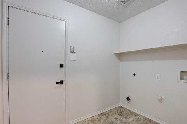 914 Gillon Dr, Arlington, TX 76001 - laundry room featuring baseboards, hookup for an electric dryer, hookup for a washing machine, a textured ceiling, and gas dryer hookup