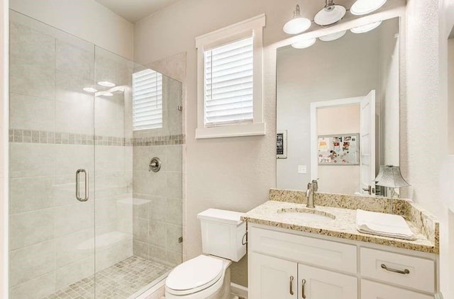 1926 N Stodghill Rd, Rockwall, TX 75087 - bathroom featuring a stall shower, toilet, and vanity