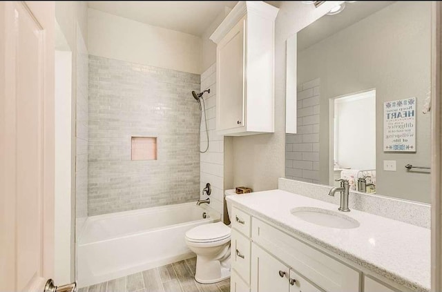 1926 N Stodghill Rd, Rockwall, TX 75087 - bathroom with vanity, toilet, shower / washtub combination, and wood finished floors