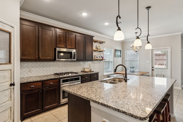 7745 Northumberland Dr, Fort Worth, TX 76179 - kitchen with appliances with stainless steel finishes, a sink, light tile patterned flooring, tasteful backsplash, and ornamental molding