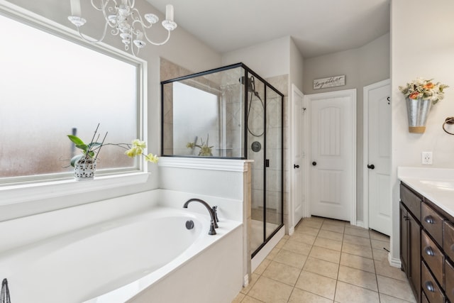 7745 Northumberland Dr, Fort Worth, TX 76179 - full bath featuring vanity, a shower stall, a garden tub, and tile patterned floors