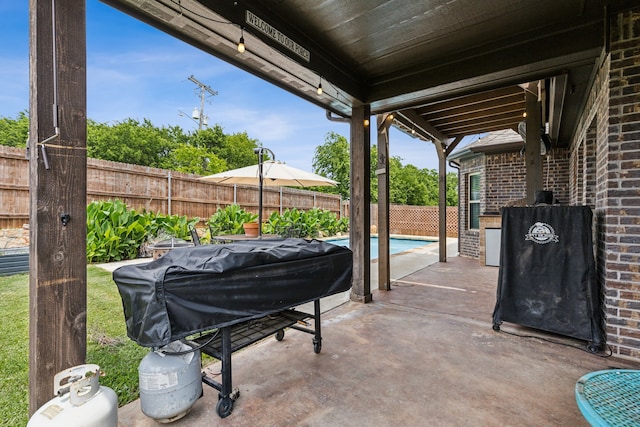 7745 Northumberland Dr, Fort Worth, TX 76179 - fenced backyard with a patio and grilling area
