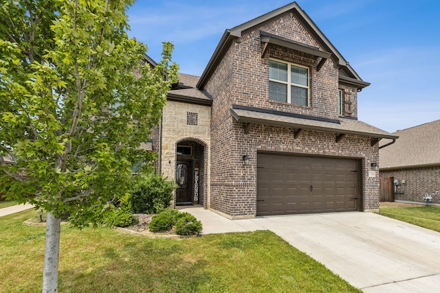 7745 Northumberland Dr, Fort Worth, TX 76179 - view of front of house featuring brick siding, an attached garage, a front yard, and concrete driveway