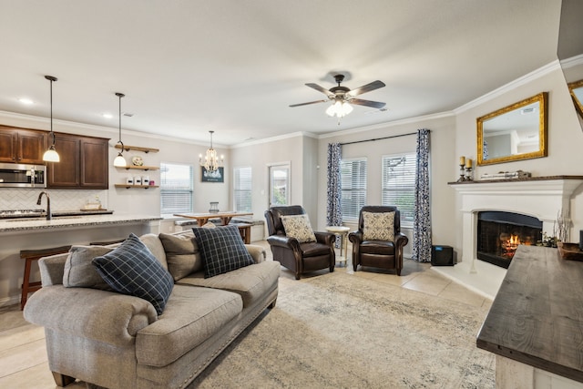 7745 Northumberland Dr, Fort Worth, TX 76179 - living room featuring light tile patterned floors, plenty of natural light, a warm lit fireplace, ceiling fan, and ornamental molding