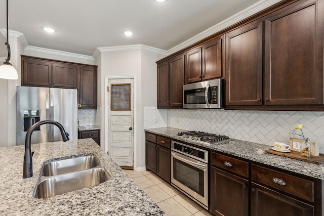 7745 Northumberland Dr, Fort Worth, TX 76179 - kitchen featuring stainless steel appliances, a sink, crown molding, dark brown cabinets, and light stone countertops