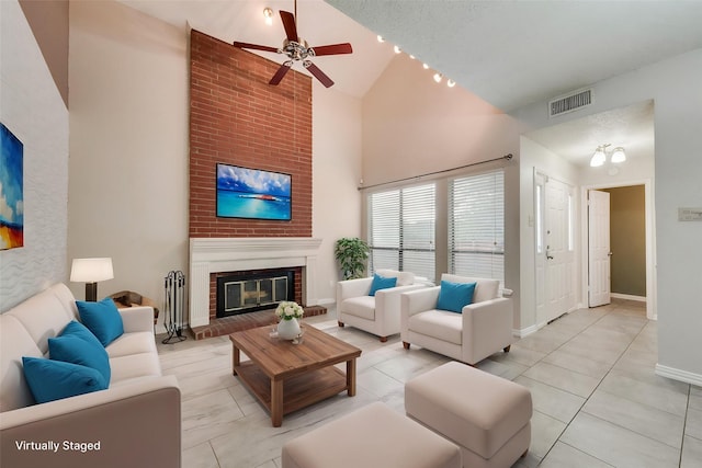 8404 Forest Ln Unit 1305, Dallas, TX 75243 - living area featuring high vaulted ceiling, a ceiling fan, a brick fireplace, and baseboards