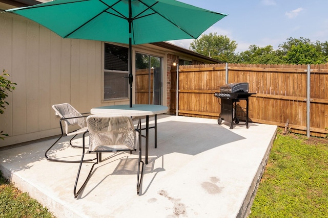 6713 Windwillow Dr, Fort Worth, TX 76137 - view of patio / terrace with fence, area for grilling, and outdoor dining area