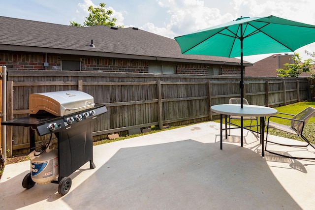 6713 Windwillow Dr, Fort Worth, TX 76137 - view of patio / terrace with a grill, fence, and outdoor dining area