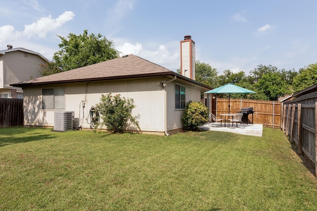 6713 Windwillow Dr, Fort Worth, TX 76137 - back of property with a chimney, a patio area, central AC unit, and a shingled roof
