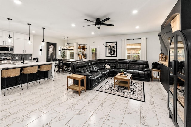 1096 Tupuna Ct, Tool, TX 75143 - living area with recessed lighting, light marble finish floors, a ceiling fan, and a chandelier