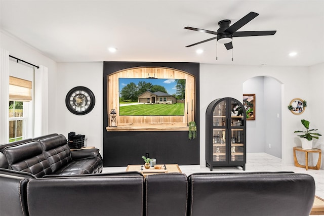 1096 Tupuna Ct, Tool, TX 75143 - living area with ceiling fan, arched walkways, recessed lighting, and baseboards