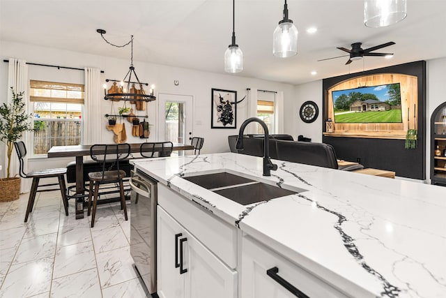 1096 Tupuna Ct, Tool, TX 75143 - kitchen with a sink, stainless steel dishwasher, white cabinetry, decorative light fixtures, and recessed lighting