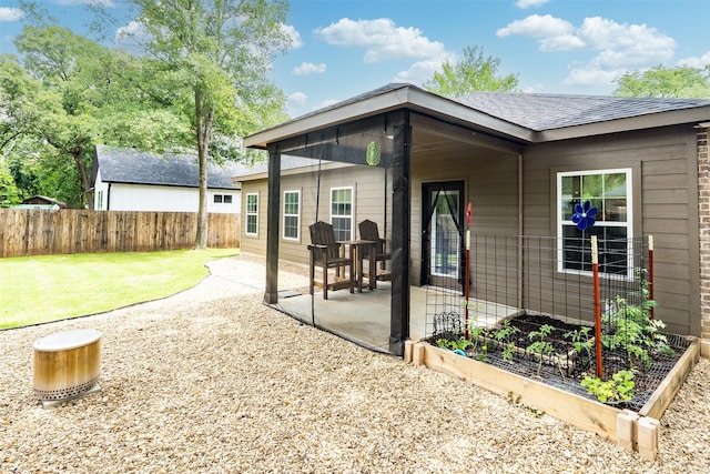 1096 Tupuna Ct, Tool, TX 75143 - rear view of house featuring a patio and a garden