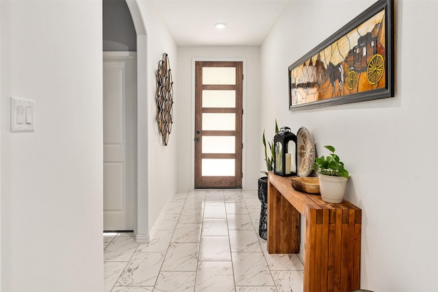 1096 Tupuna Ct, Tool, TX 75143 - foyer entrance featuring light marble finish flooring, baseboards, arched walkways, and recessed lighting