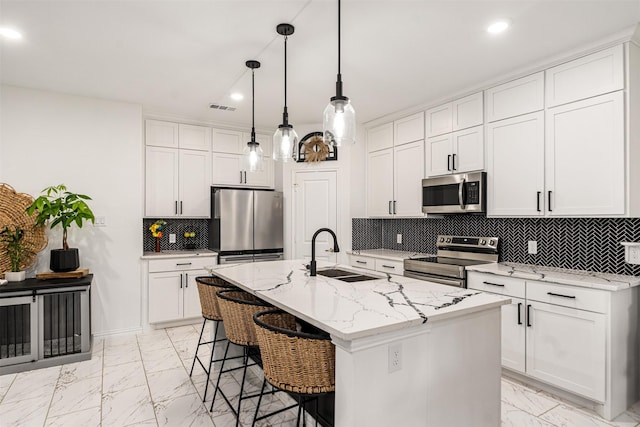 1096 Tupuna Ct, Tool, TX 75143 - kitchen with stainless steel appliances, a sink, light marble finish floors, a breakfast bar area, and recessed lighting