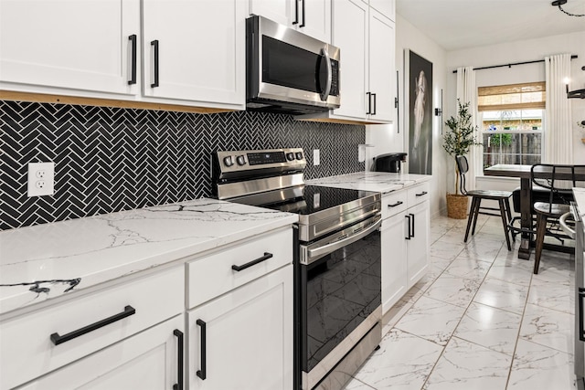 1096 Tupuna Ct, Tool, TX 75143 - kitchen with stainless steel appliances, light marble finish floors, backsplash, white cabinets, and light stone countertops