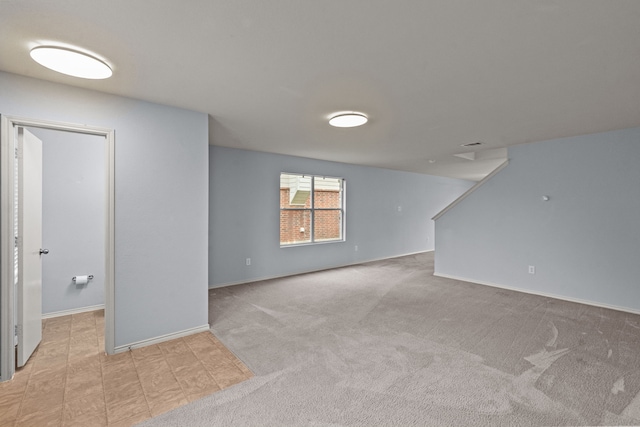 8532 Star Thistle Dr, Fort Worth, TX 76179 - below grade area with baseboards and light carpet