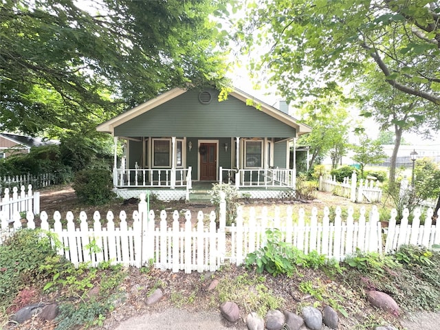 704 Harrington St, Cedar Hill, TX 75104 - bungalow-style home with a porch, a chimney, and a fenced front yard