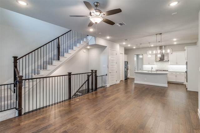 8230 Callimont Ln, Dallas, TX 75231 - unfurnished living room featuring a ceiling fan, dark wood-type flooring, recessed lighting, and a sink