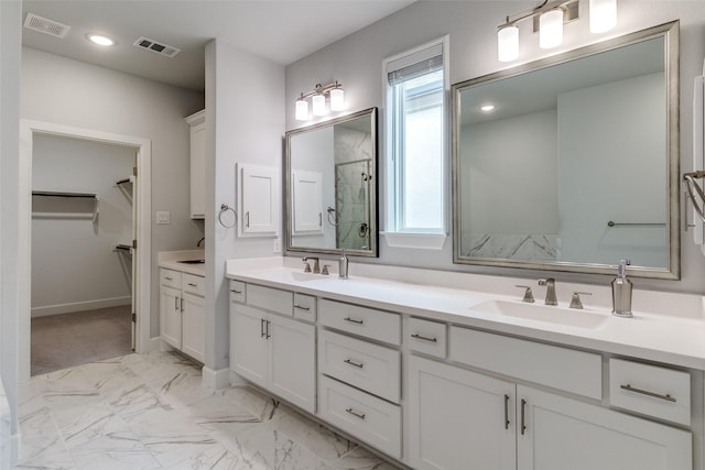 8230 Callimont Ln, Dallas, TX 75231 - bathroom with a stall shower, marble finish flooring, a spacious closet, and double vanity