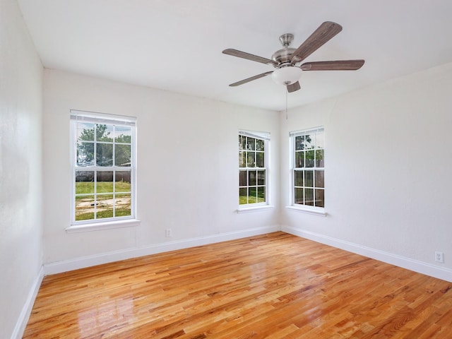 1803 4th St, Brownwood, TX 76801 - empty room featuring light wood-style floors, baseboards, and a ceiling fan