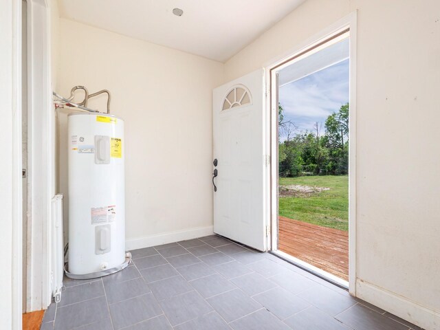 1803 4th St, Brownwood, TX 76801 - utility room featuring electric water heater